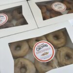 Cream Cheese Frosted Donuts in a white box